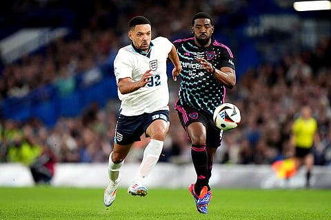 Steven Bartlett and Tion Wayne fight for the ball